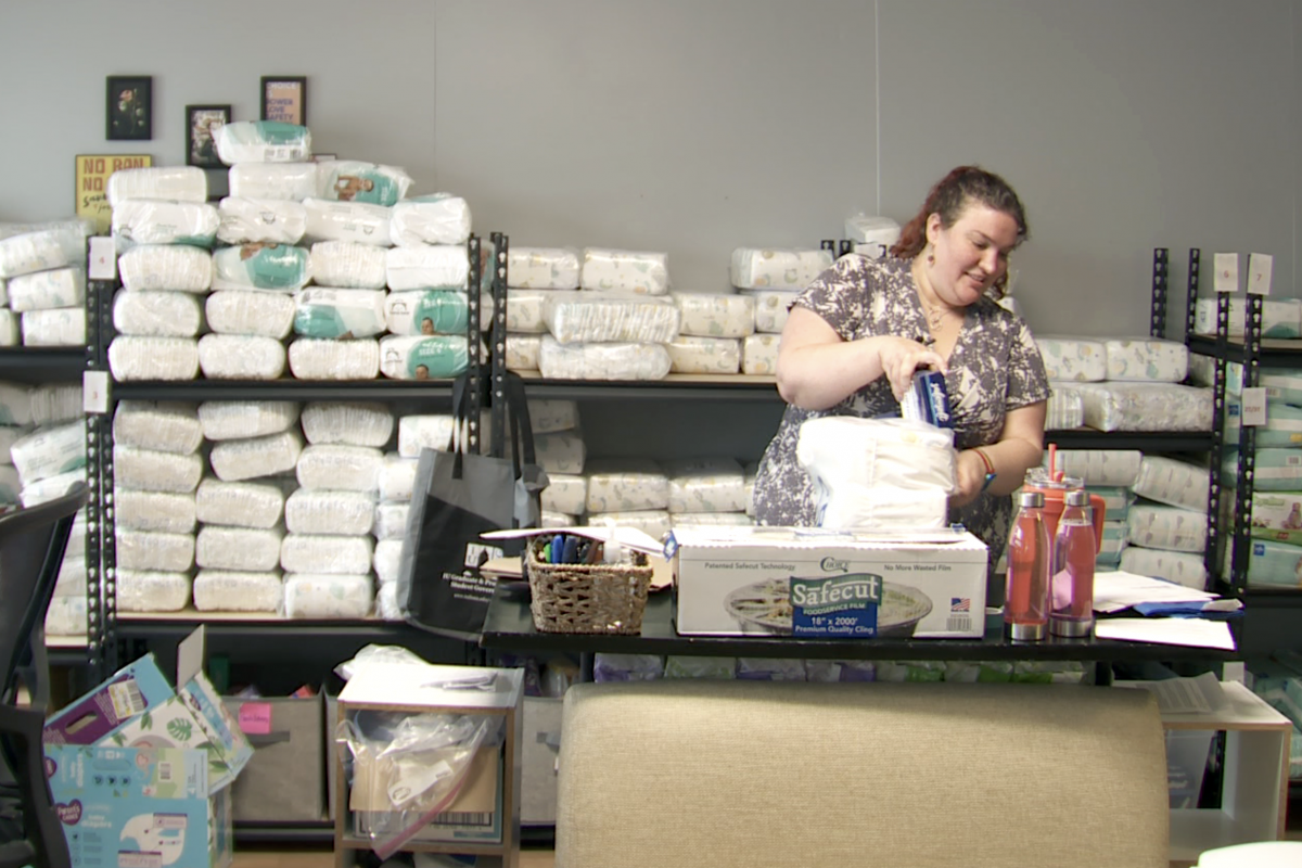 Jess Marchbank packs diaper bags at All Options Pregnancy Center in Bloomington.