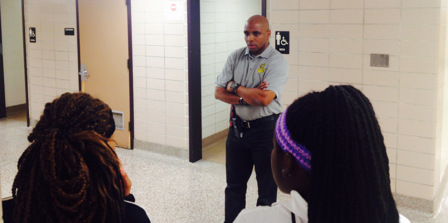 Principal Stan Law questions a large group of female students who crossed his path on the first floor of Arlington on Sept 4, 2015. The students were not in class and Law didn't believe the excuses they gave. | By Eric Weddle/WFYI News