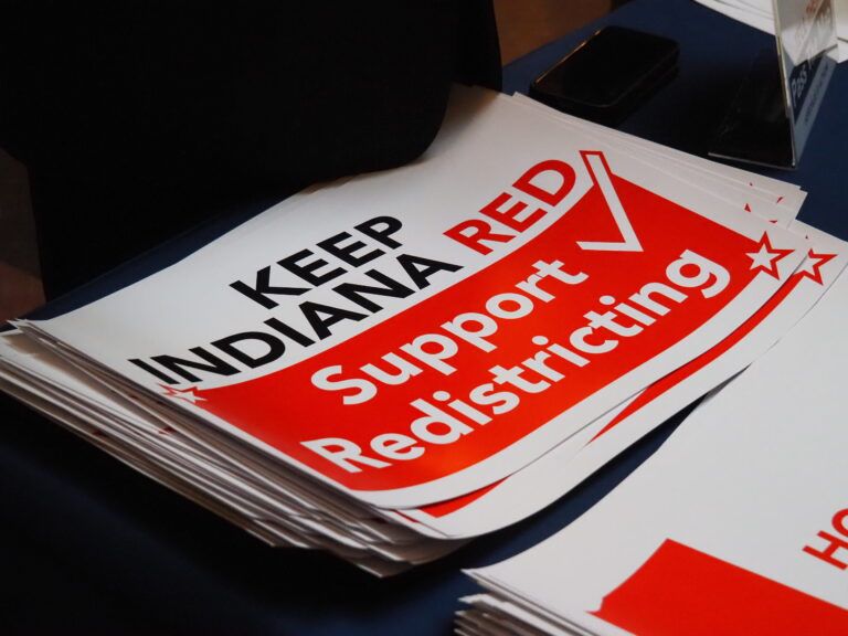Signs at a pro-redistricting rally at the Indiana Statehouse on Friday, Dec. 5, 2025.