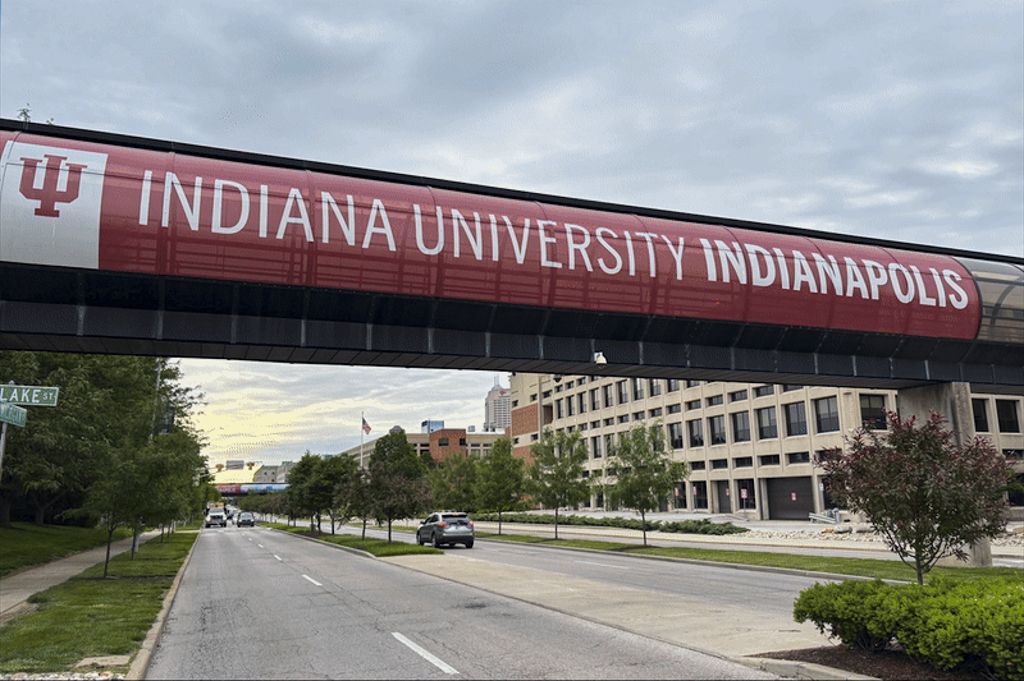 A banner advertising IU Indianapolis’ STEM programs is shown over a walkway at Michigan and Blake Streets at IU Indianapolis on May 27, 2025.
