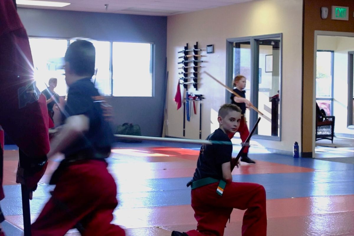 Skyler Wampler does exercises at martial arts class. Doing martial arts has helped his confidence grow. 
