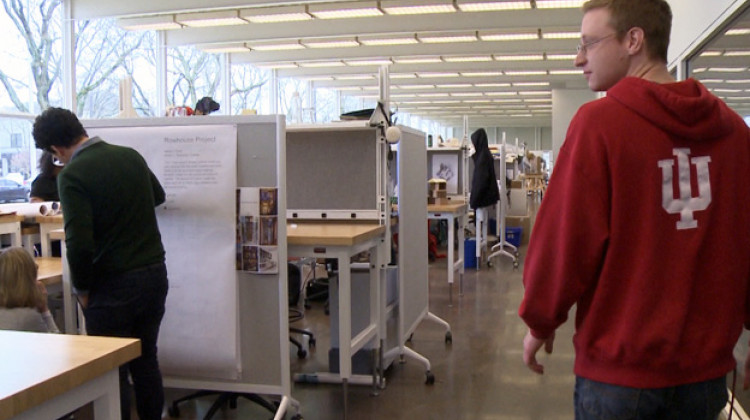 First year graduate student Daniel Green walks through the student workstations in the Republic Building. - Joe Hren/WFIU-WTIU News