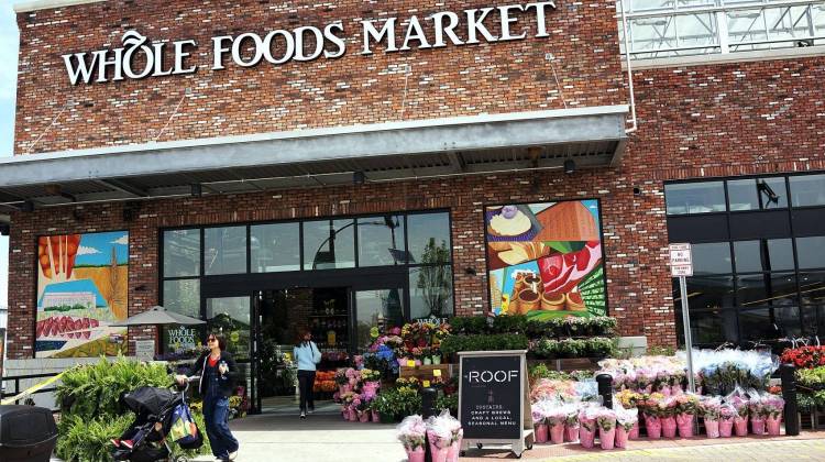 People walk out of a Whole Foods Market in the Brooklyn borough of New York. (Spencer Platt/Getty Images)