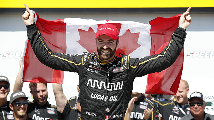 FILE - In this July 8, 2018, file photo, James Hinchcliffe celebrates after winning an IndyCar Series auto race at Iowa Speedway in Newton, Iowa. Hinchcliffe will return to Andretti Autosport for three races this season, including the Indianapolis 500.  - AP Photo/Charlie Neibergall, File