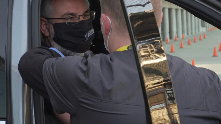 Gov. Eric Holcomb and other state officials received their COVID-19 vaccine at the Indianapolis Motor Speedway Friday. - Alan Mbathi/IPB News