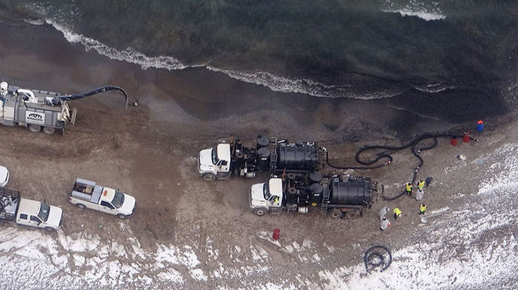 Cleanup crews work along the Lake Michigan shoreline near the BP Whiting Refinery in Whiting on March 25, 2014, to recover crude oil discharged from the refinery. - Petty Officer 3rd Class Parker Wood/U.S. Coast Guard