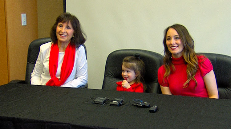 Elizabeth Corley (right) at a Wear Red event with her mother and youngest daughter. - Steph Whiteside/Side Effects Public Media