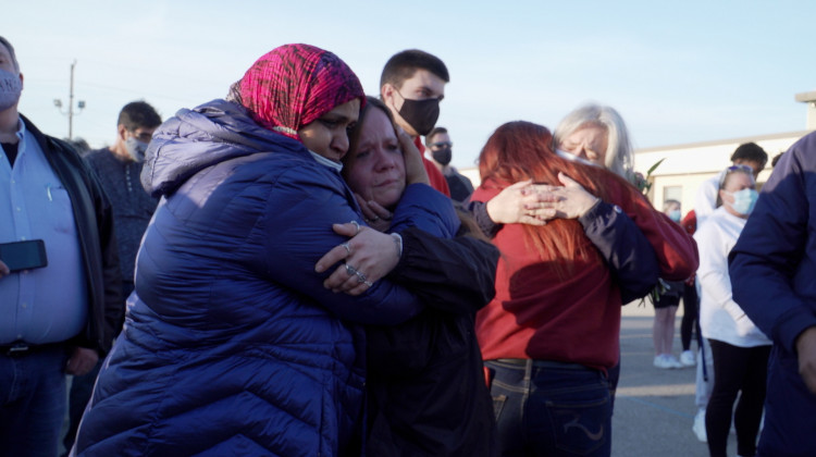 About 200 people gathered for a candlelight vigil Saturday evening to remember those who died in Thursday's mass shooting at a FedEx facility. - Alan Mbathi/IPB News