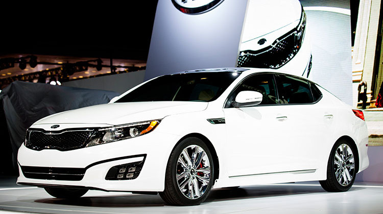 FILE- In this March 27, 2013, file photo the 2014 Kia Optima is unveiled during the 2013 New York International Auto Show in New York. The U.S. government’s highway safety agency said Monday, April 1, 2019, that it has decided to open two new investigations into fires involving Hyundai and Kia vehicles.  - AP Photo/John Minchillo, File