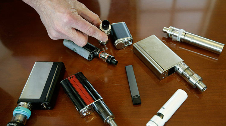 FILE - This Tuesday, April 10, 2018 file photo shows vaping devices confiscated from high school students. - AP Photo/Steven Senne, File