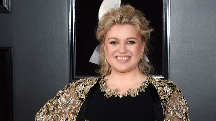 Kelly Clarkson, shown here at the 60th annual Grammy Awards in January, will sing the national anthem at this year's Indianapolis 500. - Evan Agostini/Invision/AP
