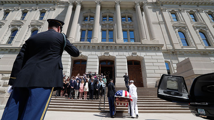 A military honor guard carries the casket of Sen. Richard Lugar into the Indiana Statehouse in Indianapolis, Tuesday, May 14, 2019. Lugar will lay in repose in the Statehouse rotunda until noon Wednesday, followed by his funeral. He died April 28 at age 87. - AP Photo/Michael Conroy