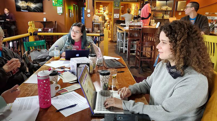 As “Stop the Bans” rallies take place nationwide, in a cool, rainy Fort Wayne, protesters took too a local coffee shop to write letters to political leaders, and media outlets. - Barb Anguiano/WBOI