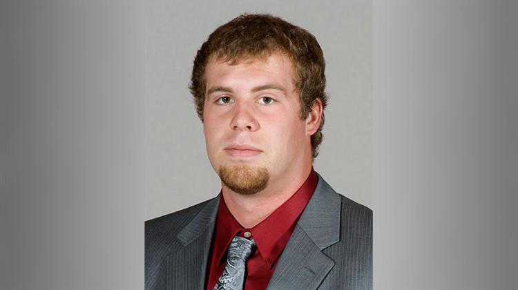 In this undated photo, provided by Southern Illinois University, Jason Seaman, a defensive end for the SIU football team, poses for a photo in Carbondale, Ill. Seaman, now a science teacher at Noblesville West Middle School in Noblesville, Ind., subdued a student armed with two handguns who opened fire inside his classroom Friday, May, 25, 2018.  - Southern Illinois University via AP
