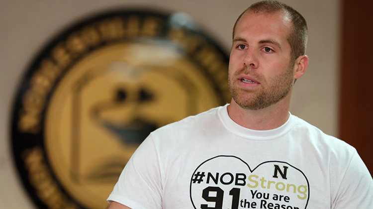 Jason Seaman, a seventh grade science teacher at Noblesville West Middle School in Noblesville, Ind., speaks during a news conference Monday, May 28, 2018. Seaman tackled and disarmed a student with a gun at the school on Friday. He was shot but not seriously injured. - AP Photo/Michael Conroy