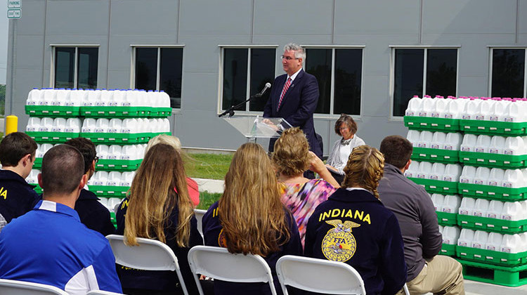 Gov. Eric Holcomb greets the crowd at the opening of the milk processing plant in Fort Wayne. - Araceli Gomez-Aldana/WBOI