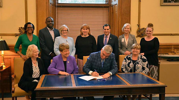 Governor Eric Holcomb signs legislation to create the Maternal Mortality Review Committee. - Photo courtesy of Riley Childrenâ€™s Health