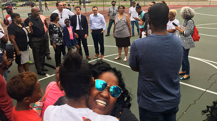Community members gathered on a basketball court at the Martin Luther King, Jr. Recreation Center to talk about gun violence. - Jennifer Weingart/WVPE News