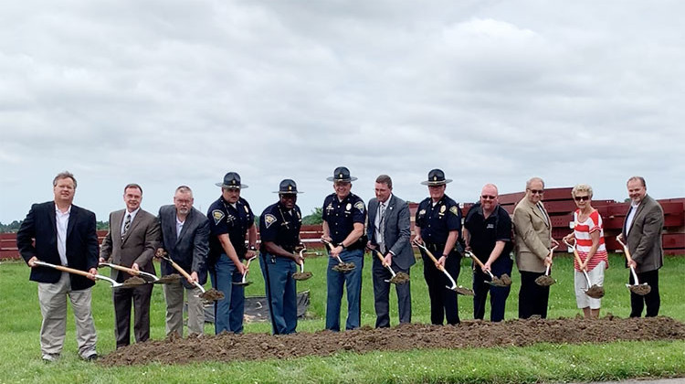 Representatives from the Indiana State Police and the city of Greenwood complete the ceremonial ground breaking for the new aviation hangar at Indy South Greenwood Airport on Monday, June 24, 2019. - Doug Jaggers/WFYI