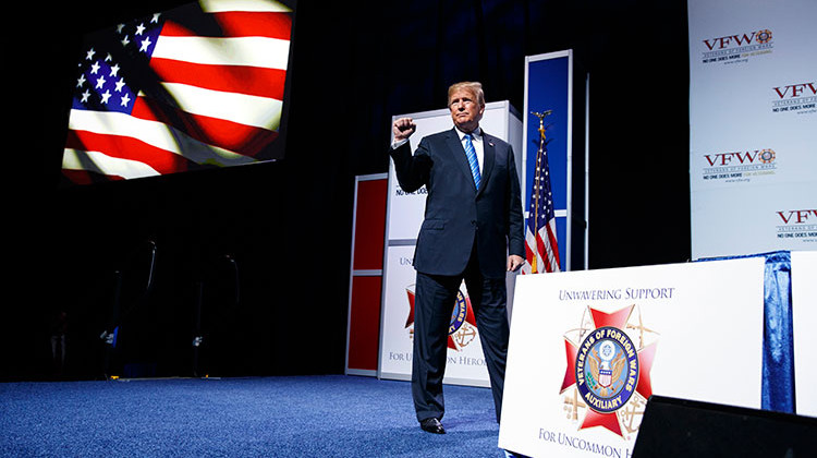 President Donald Trump pumps his fist after speaking during the Veterans of Foreign Wars of the United States National Convention on, Tuesday, July 24, 2018, in Kansas City, Mo.  - AP Photo/Evan Vucci