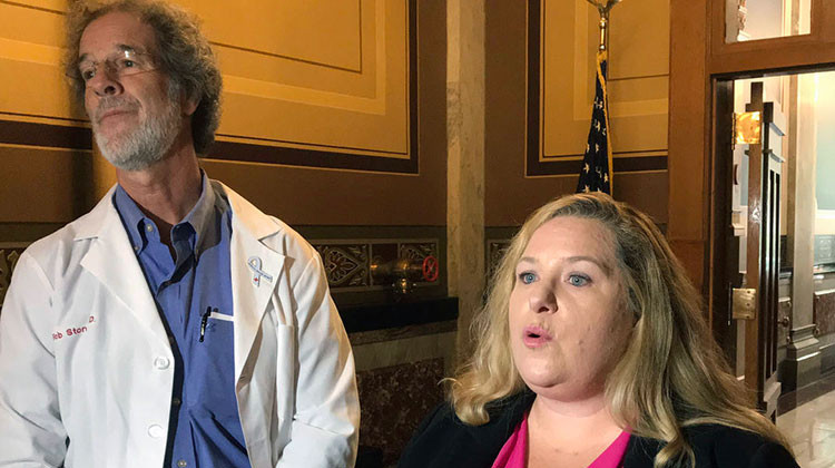 Protect Our Care Indiana spokesperson Kate Shepherd calls for Indiana to withdraw from a lawsuit that seeks to dismantle the Affordable Care Act. Alongside her is Rob Stone, a Bloomington physician and director of Hoosiers For A Commonsense Health Plan. - Brandon SMith/IPB News