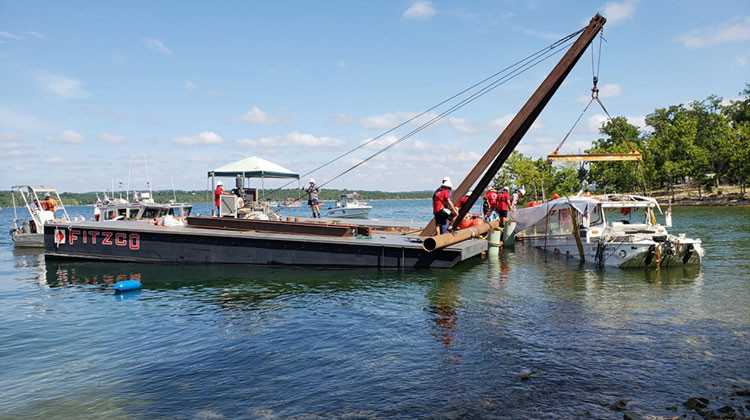 FILE - The duck boat that sank during a thunderstorm on July 19 is raised from Table Rock Lake in Branson, Mo. A company facing multiple lawsuits over the accident has invoked an 1851 law that allows vessel owners to try to limit their legal damages. - U.S. Coast Guard, File