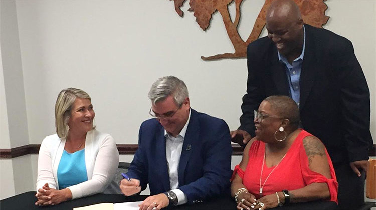 Indiana Gov. Eric Holcomb signs the diabetes action plan bill. - Jill Sheridan/IPB News