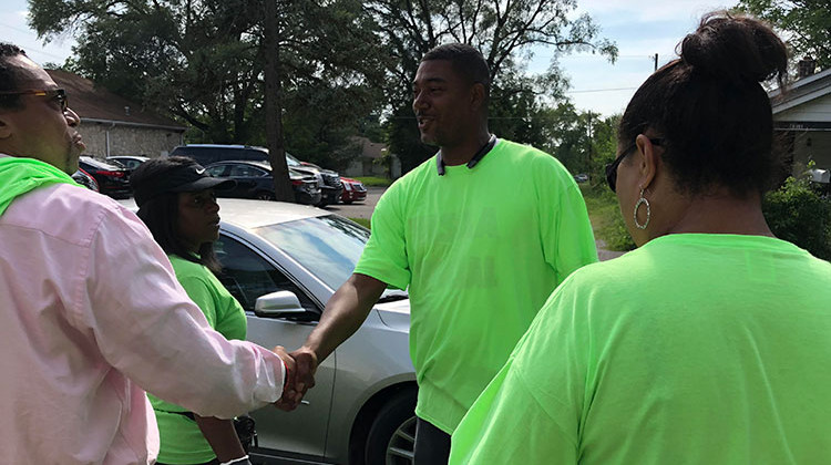 Robert Fry, one of two recently Indy "peacemakers," greets volunteers before a community claenup walk on Thursday, Aug. 9, 2018. - Carter Barrett/WFYI