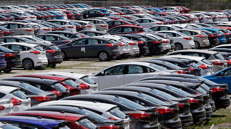 FILE - In this May 1, 2015, file photo Ford Focus vehicles are seen on a storage lot in Ypsilanti, Mich. Ford is extending the warranties on about 560,000 small cars to cover a litany of problems with a troubled six-speed automatic transmission. The latest move covers 2014 through 2016 model year Focuses built before Nov. 5, 2015, as well as 2014 and 2015 Fiestas built before Oct. 15, 2014. - AP Photo/Carlos Osorio, File