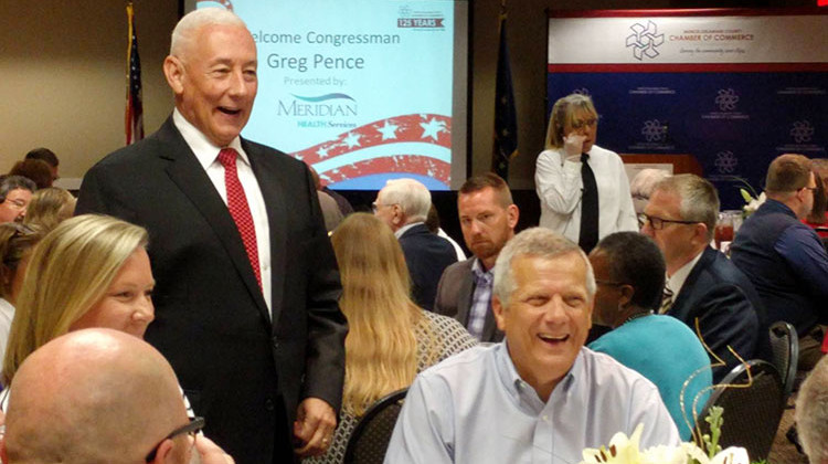 U.S. Rep. Greg Pence (R-6th District), standing, talks with constituents at a Chamber of Commerce lunch in Muncie. - Stephanie Wiechmann