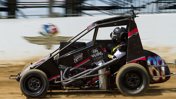 Sarah Fisher takes a lap around the quarter-mile dirt track the Indianapolis Motor Speedway built inside turn three of the asphalt oval. - Doug Jaggers/WFYI