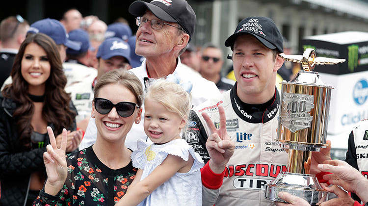 NASCAR Cup Series driver Brad Keselowski (2) celebrates with his wife Paige and daughter Scarlett after winning the NASCAR Brickyard 400 auto race at Indianapolis Motor Speedway, in Indianapolis Monday, Sept. 10, 2018.  - AP Photo/Michael Conroy
