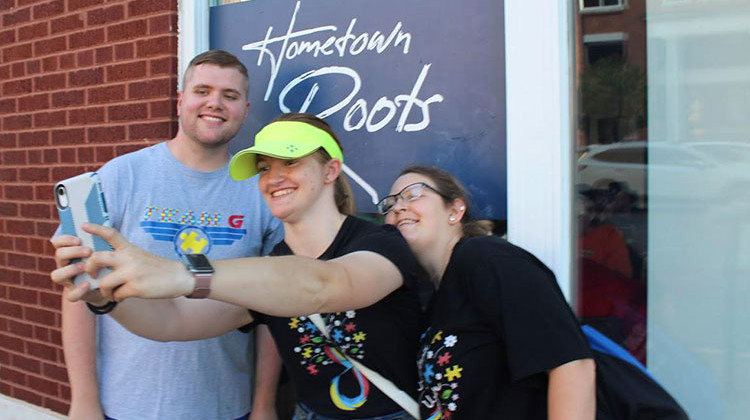 Henderson, Ky., was the scene of a scavenger hunt by members of a social group geared toward adults with autism. (L to R) Jesse Hopgood, Rose Schriener and Hannah Hall pose for a selfie as part of the hunt. - Isaiah Seibert/Side Effects Public Media