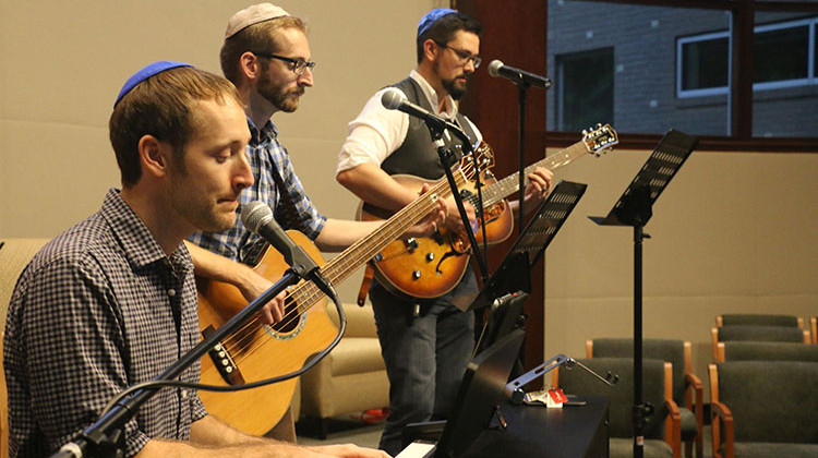 Josh Riedford, Aaron Riedford, and Eric Lund rehearse before the monthly Shabbat Rocks service. - Isaiah Seibert/WNIN