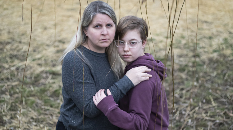 Hannah Norris, 13, and her mother, Lisa Norris, pose for a portrait at their home, Saturday, Dec. 10, 2022, in Hilliard, Ohio. - Joshua A. Bickel / for the Center for Public Integrity