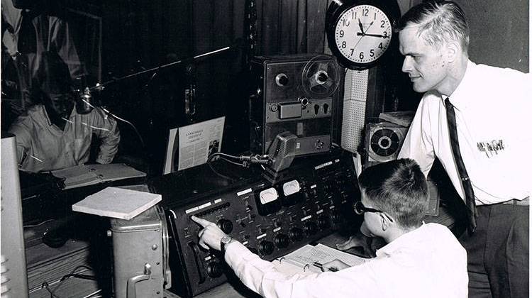 Art Van Allen, who managed the station from 1958 to 1986, is pictured with a student operator. - Photo from Mary Van Allen’s personal collection.