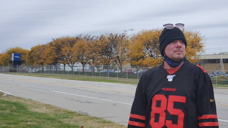 Duane Oreskovic stands across the street from the Indianapolis Carrier plant he worked at for about five years until him and hundreds of others were laid off from the company moving their jobs to Mexico. - Samantha Horton/IPB News