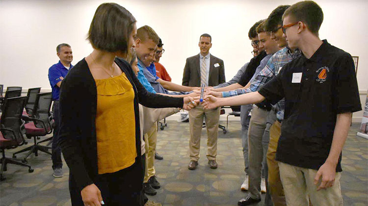 Youth apprentices with CareerWise Elkhart County participate in a team-building activity while Jason Harrison of Horizon Education Alliance supervises.  - Justin Hicks/IPB News