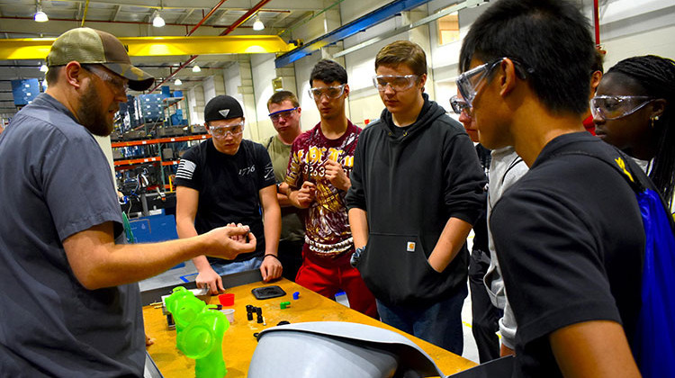 Jeremey Rorie shows Penn High School students what he does for work at B&B Molders in Mishawaka. - Justin Hicks/IPB News