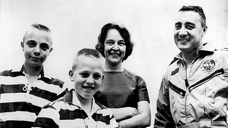 FILE - In this March 25, 1965 file photo, astronaut Virgil I. Grissom is reunited with his wife and sons at Cape Kennedy, Fla., after his three-orbit flight. From left: Scott (14), Mark (11), and Betty Grissom. - AP Photo/pool, file