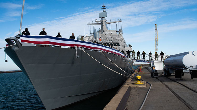 The crew of the future littoral combat ship USS Indianapolis (LCS 17) man the rails during a pre-commissioning rehearsal at Burns Harbor. - U.S. Navy Photo by Mass Communication Specialist 3rd Class Timothy Haggerty/Released