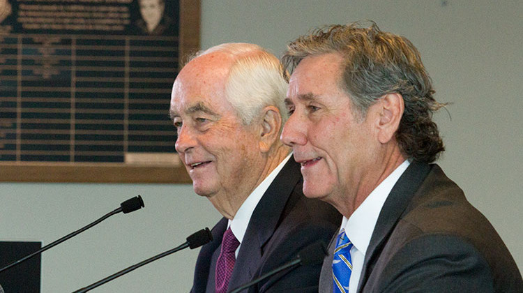 Roger Penske (left) and Tony George (right) speak to the media during a press conference announcing the sale of Hulman and Company to the Penske Corporation, on Monday, Nov. 4 2019 at the Indianapolis Motor Speedway. - Doug Jaggers/WFYI
