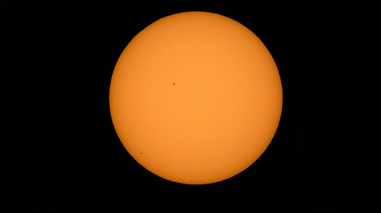 The planet Mercury is seen in silhouette, lower third of image, as it transits across the face of the sun Monday, May 9, 2016, as viewed from Boyertown, Pennsylvania. Mercury passes between Earth and the sun only about 13 times a century. - NASA/Bill Ingalls