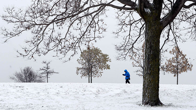 A lone hiker navigates the 31st street beach bike trail in a stiff wind and blowing snow off Lake Michigan, Monday, Nov. 11, 2019, in Chicago. - AP Photo/Charles Rex Arbogast