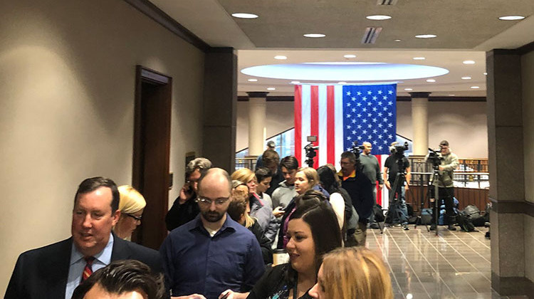 People wait in line to get in to the Hamilton County courtroom for Wednesday's disposition for the 13-year-old boy who shot a teacher and classmate at Noblesville West Middle School in May. - Carter Barrett/WFYI