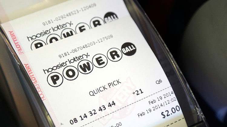 Powerball tickets print out at Buck's Super Market in Indianapolis, Wednesday, Feb. 19, 2014. - AP Photo/Michael Conroy