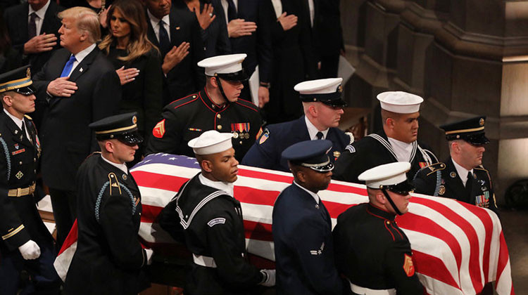 A military honor guard carries the casket of former President George H.W. Bush during the funeral at the National Cathedral in Washington, D.C. - Cheryl Diaz Meyer for NPR