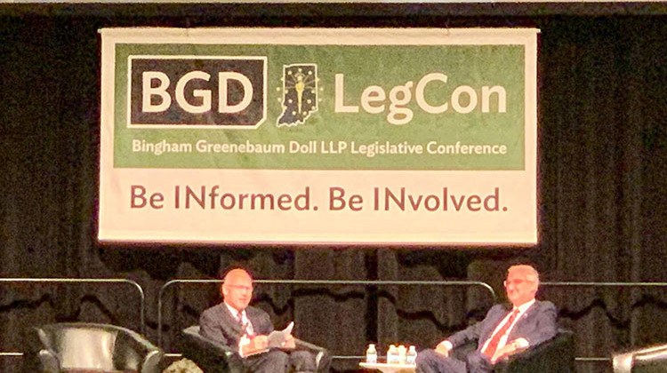 Gov. Eric Holcomb, right, speaks at the 2019 Bingham Greenebaum Doll Legislative Conference.  - Brandon Smith/IPB News