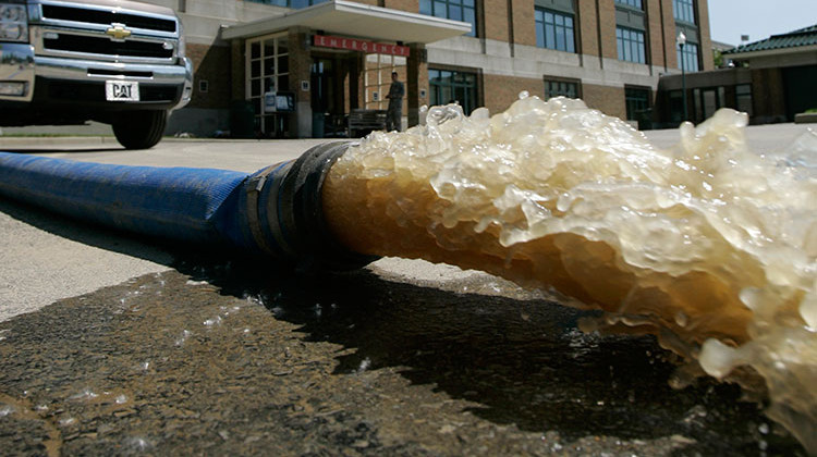 Water is pumped out of the Columbus Regional Hospital in Columbus, Ind., Sunday, June 8, 2008. The flooding destroyed 48 homes. - AP Photo/Darron Cummings