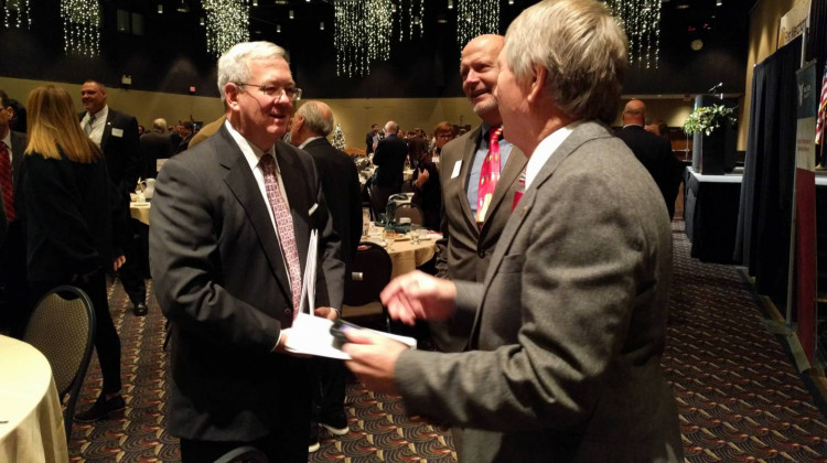 Michael Hicks (left) tells the regional business community that area jobs aren't attractive en masse. - Stephanie Wiechmann/IPR News